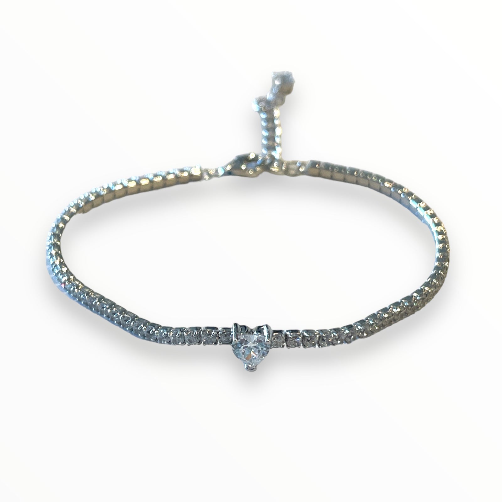 Thin tennis bracelet with heart